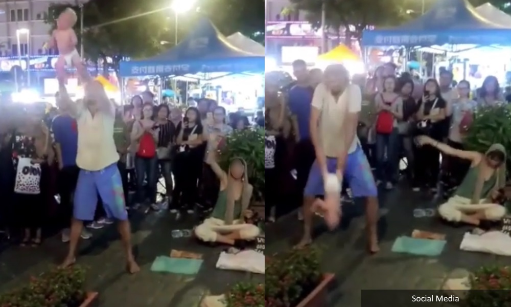 Russian couple detained for tossing baby in street performance