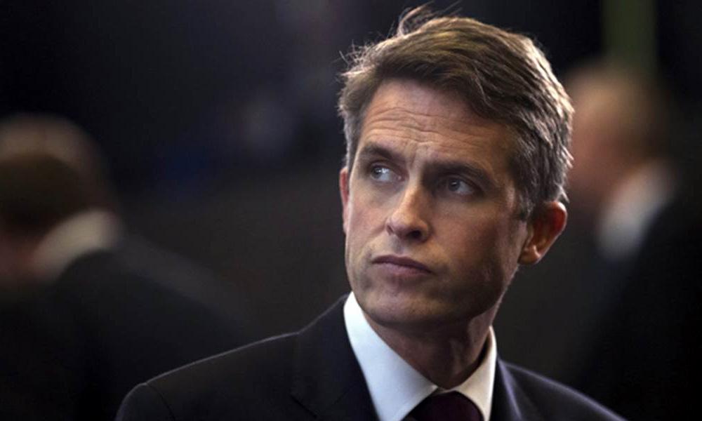 UK's May fires defence secretary over Huawei leak