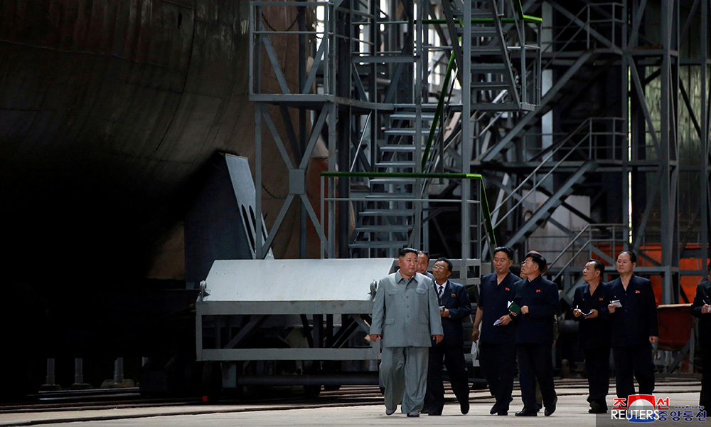Kim inspects new submarine, signals possible ballistic missile development