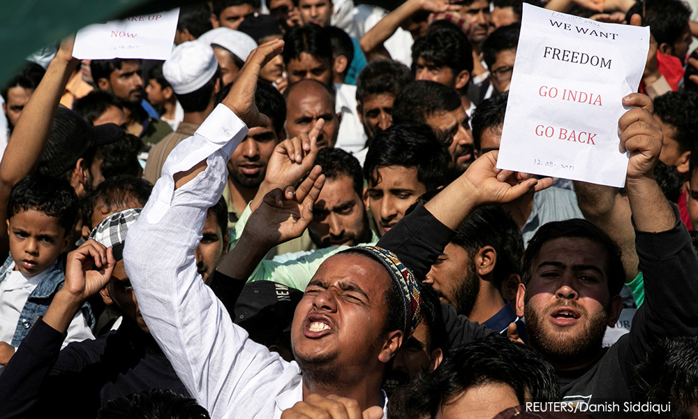 Besieged Kashmiri neighborhood in test of wills with India