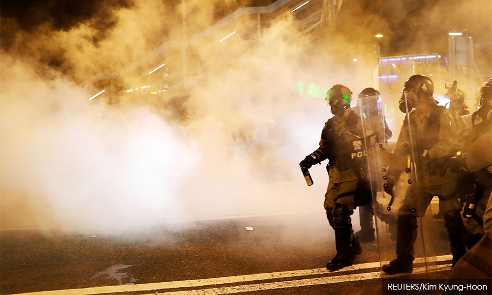 China says protesters like 'terrorists', airport reopens