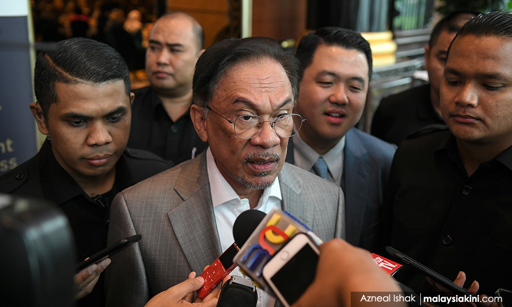 Anwar tells aide to meet cops over assault claim