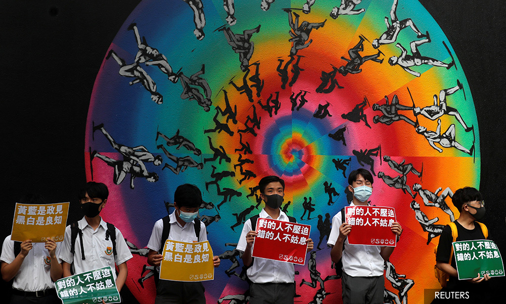 Hong Kong protesters plan mall sit-ins after hill-top human chains