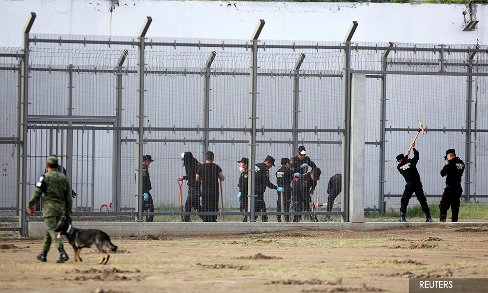 Police, dogs search notorious Mexican prison for clandestine graves