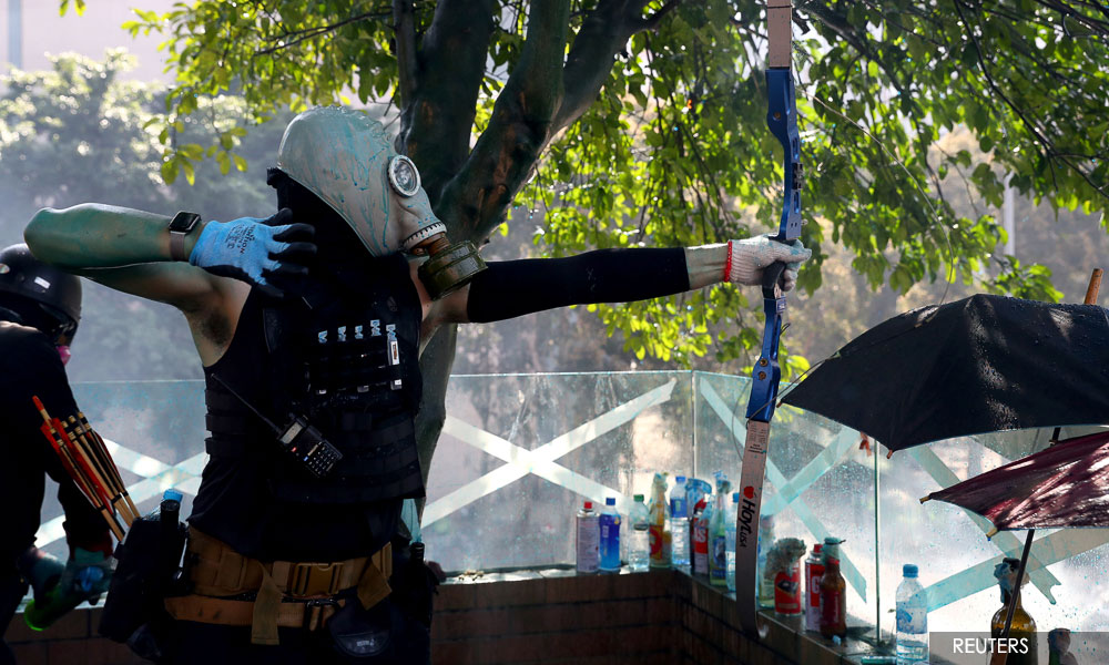 HK campus protesters fire arrows as unrest spreads across Kowloon