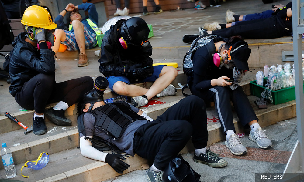 Student protesters hold out as HK leader urges peaceful resolution