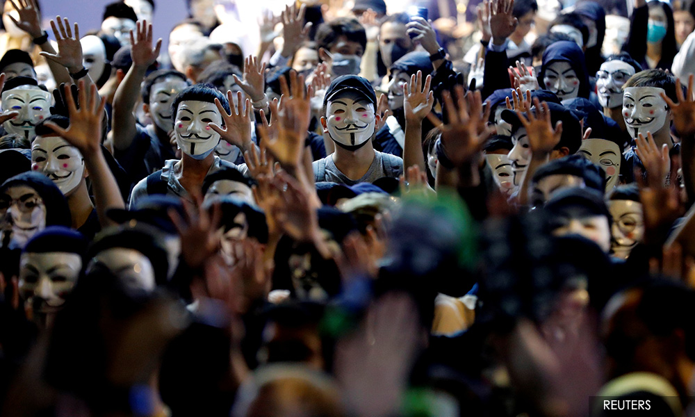 China to 'perfect' HK system as water cannon breaks up protest
