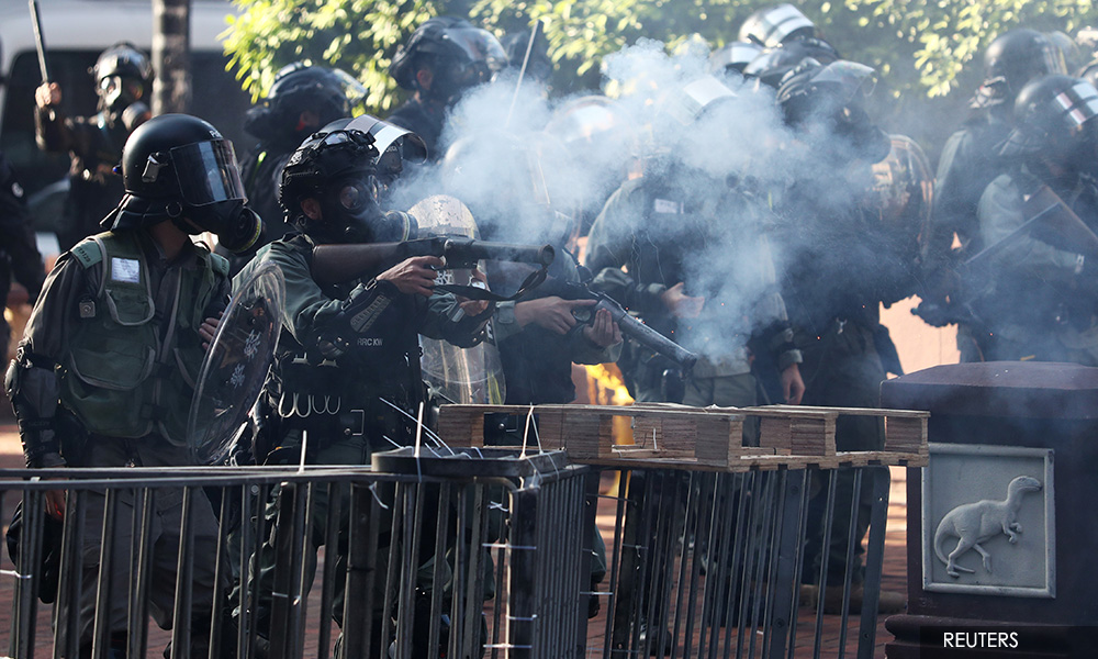 Hong Kong police fire rubber bullets, tear gas to pin back campus protesters