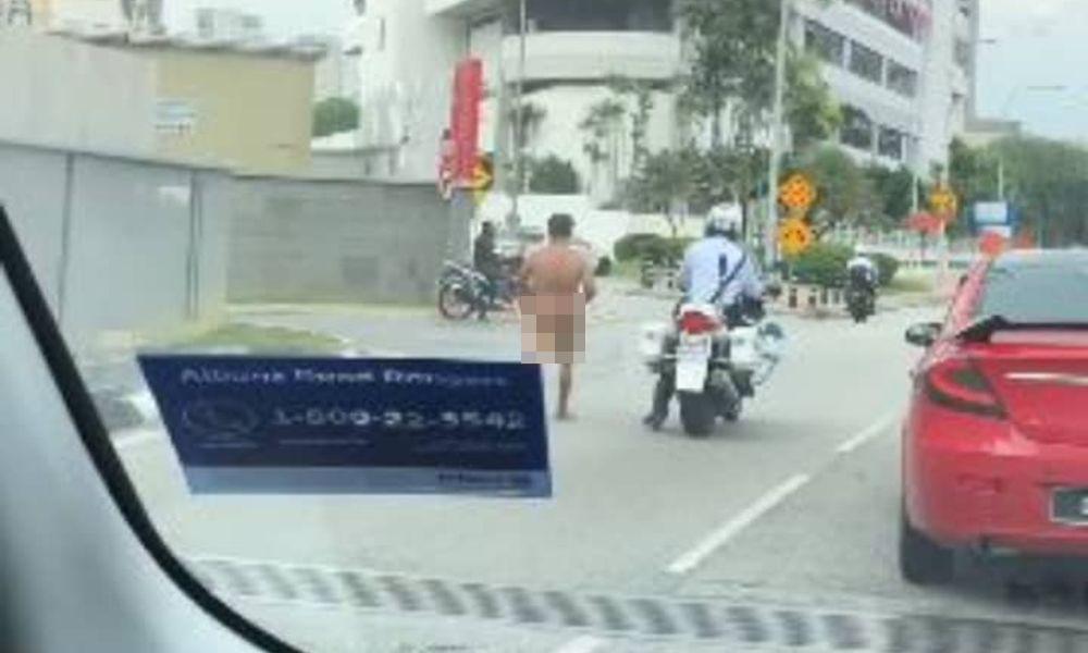 Man running naked in KL gets clothes, pocket money from cops