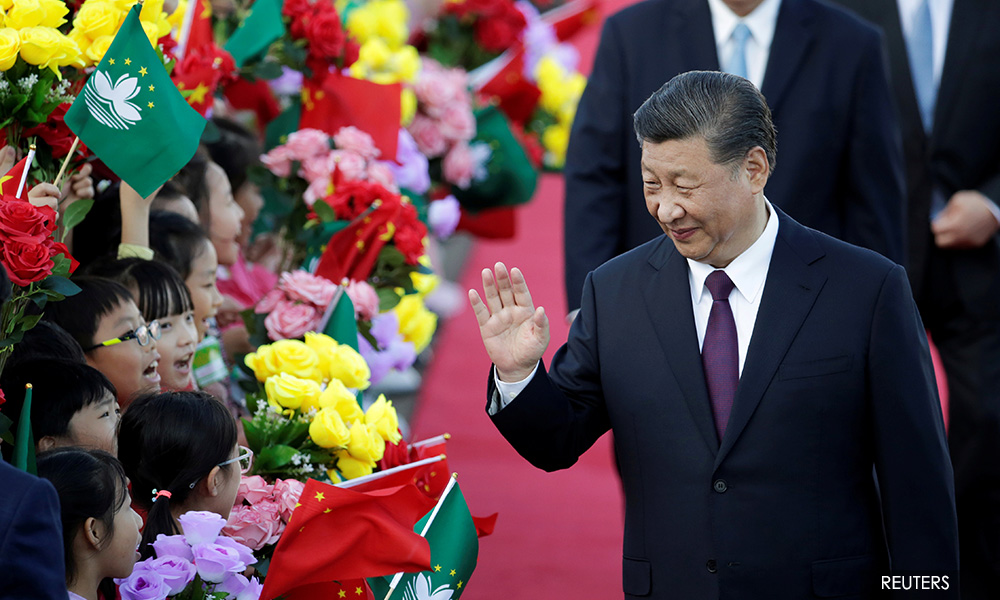 Chinese leader Xi visits gambling hub Macau as nearby Hong Kong seethes