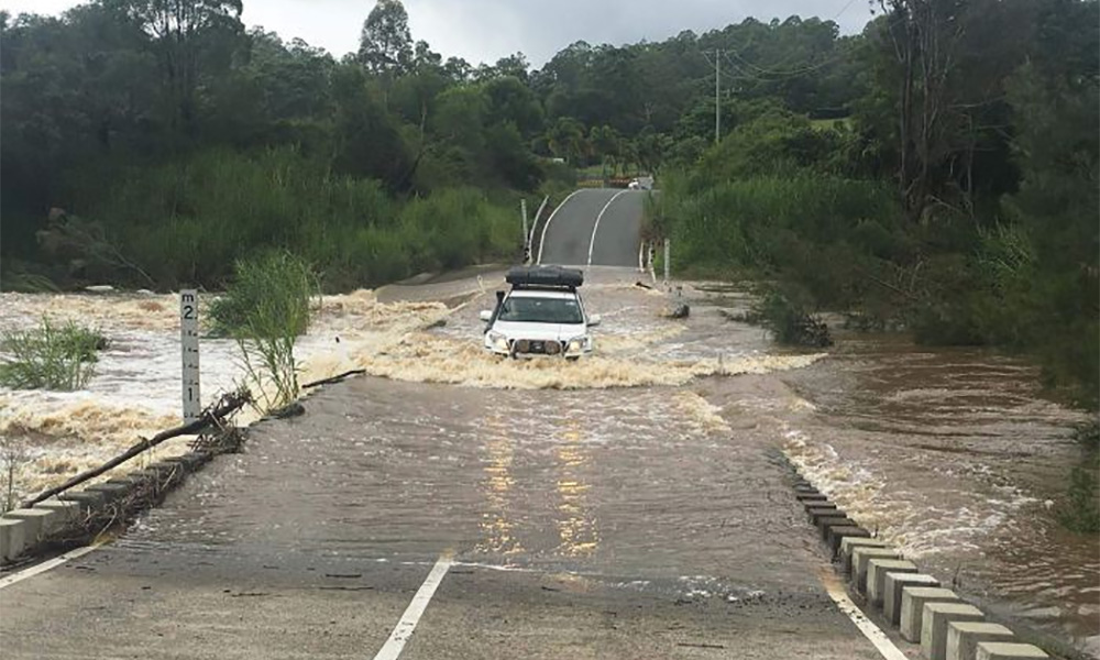 Heavy rains dampen fires in Australia's Queensland state, cause flooding