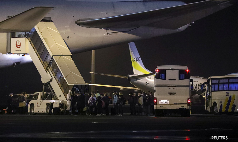 Hundreds of Americans flown home from cruise ship, 14 with coronavirus