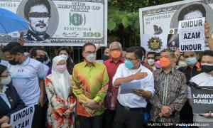 When Anwar called for Azam to be suspended over shares scandal