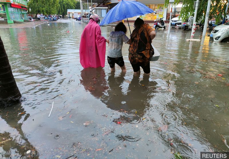 China lashed by year's first typhoon, record rains forecast